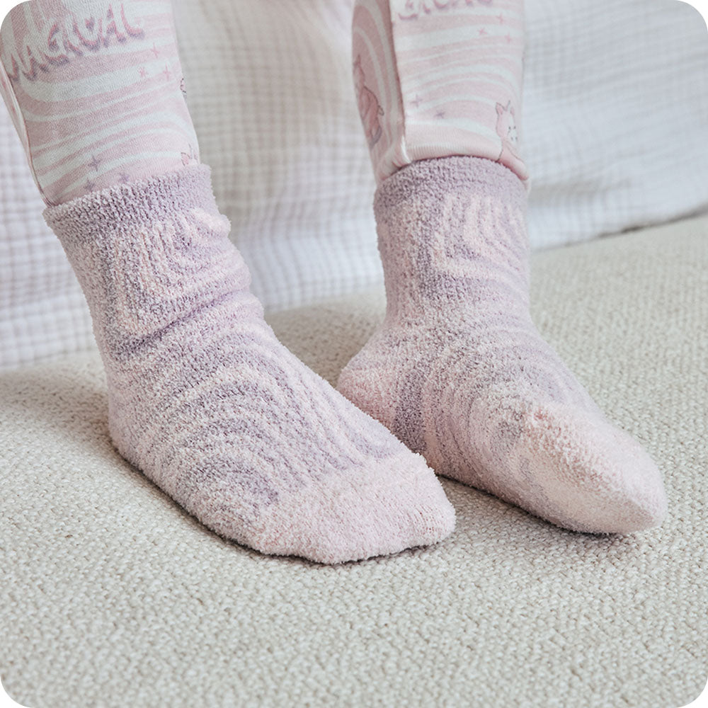 Image 108: pink unicorn socks on kids feet