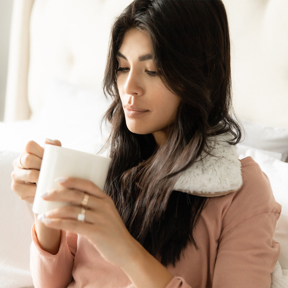 Image 98: Woman wearing Soothing Warmies Neck Wrap in Marshmallow Brown
