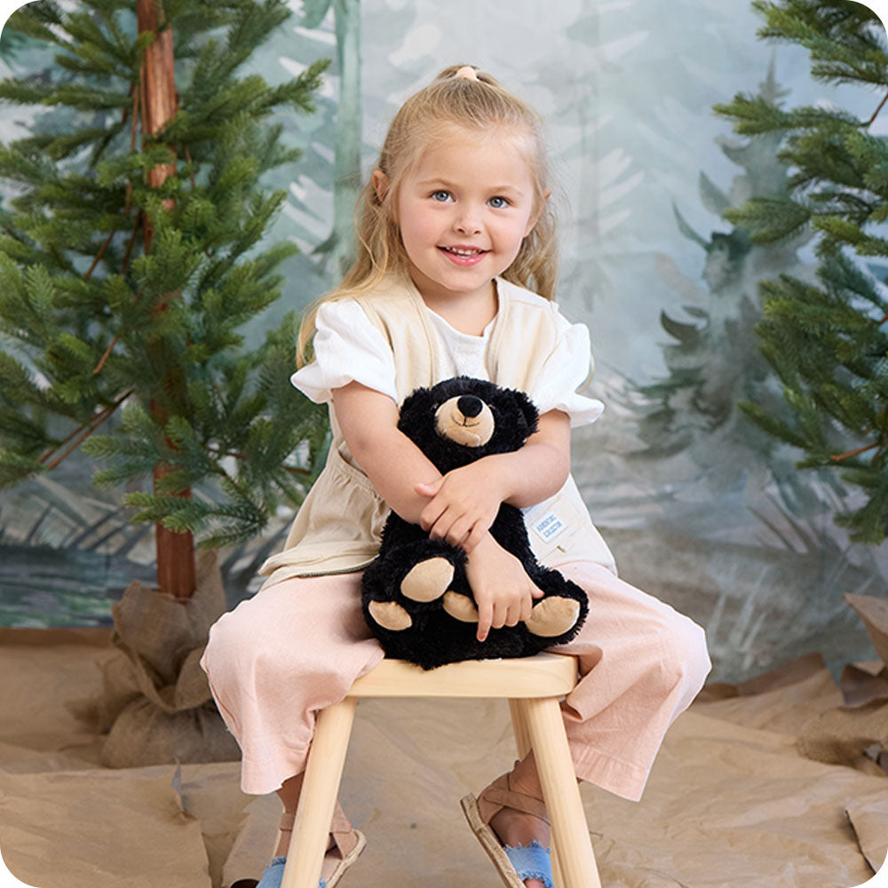 Image 100: black bear warmies lifestyle
