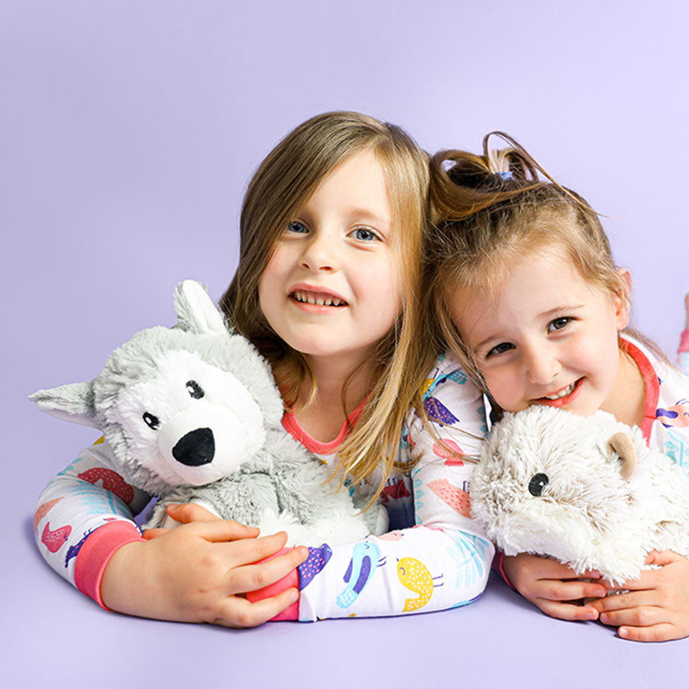 Image 103: kids playing with husky stuffed animal