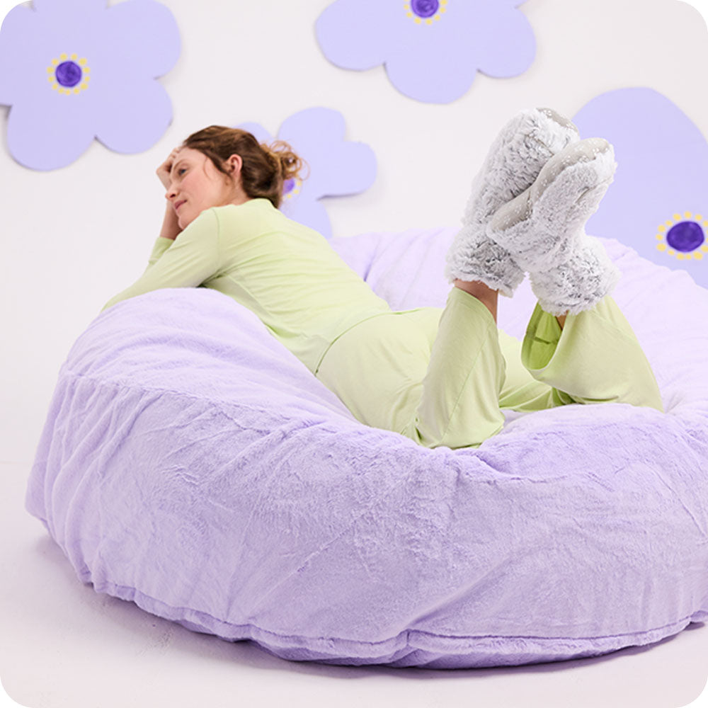 Image 99: woman wearing gray warmies slipper boots